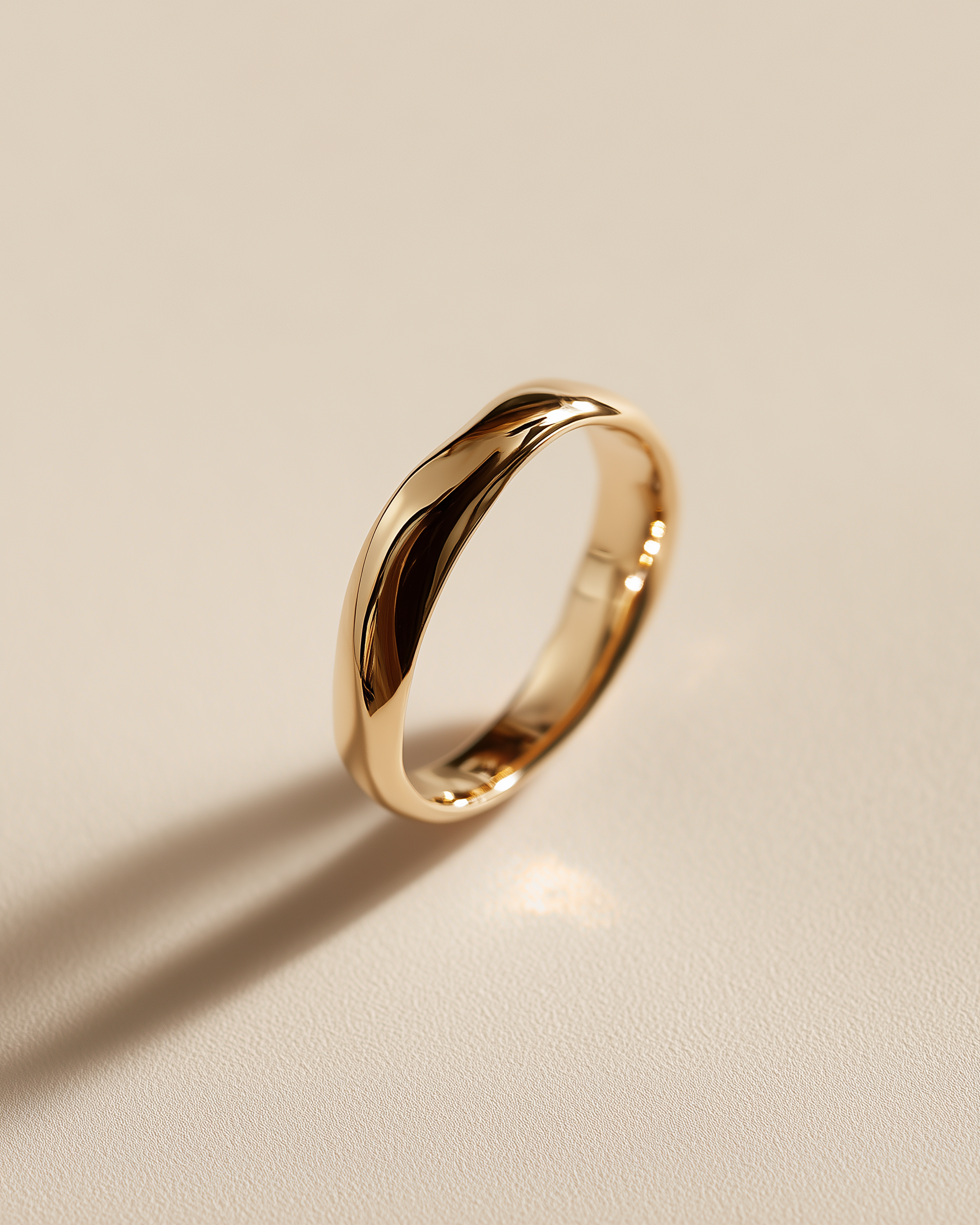 Solid 14k gold sculptural wave band ring on stone
